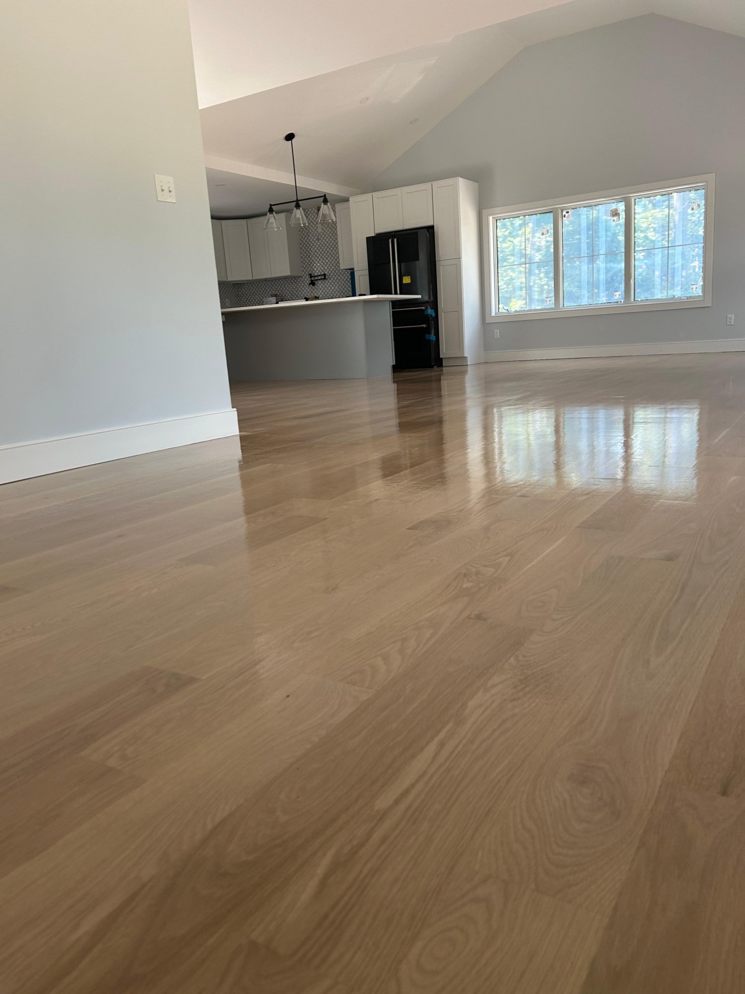 Open living area fresh hardwood floor installation