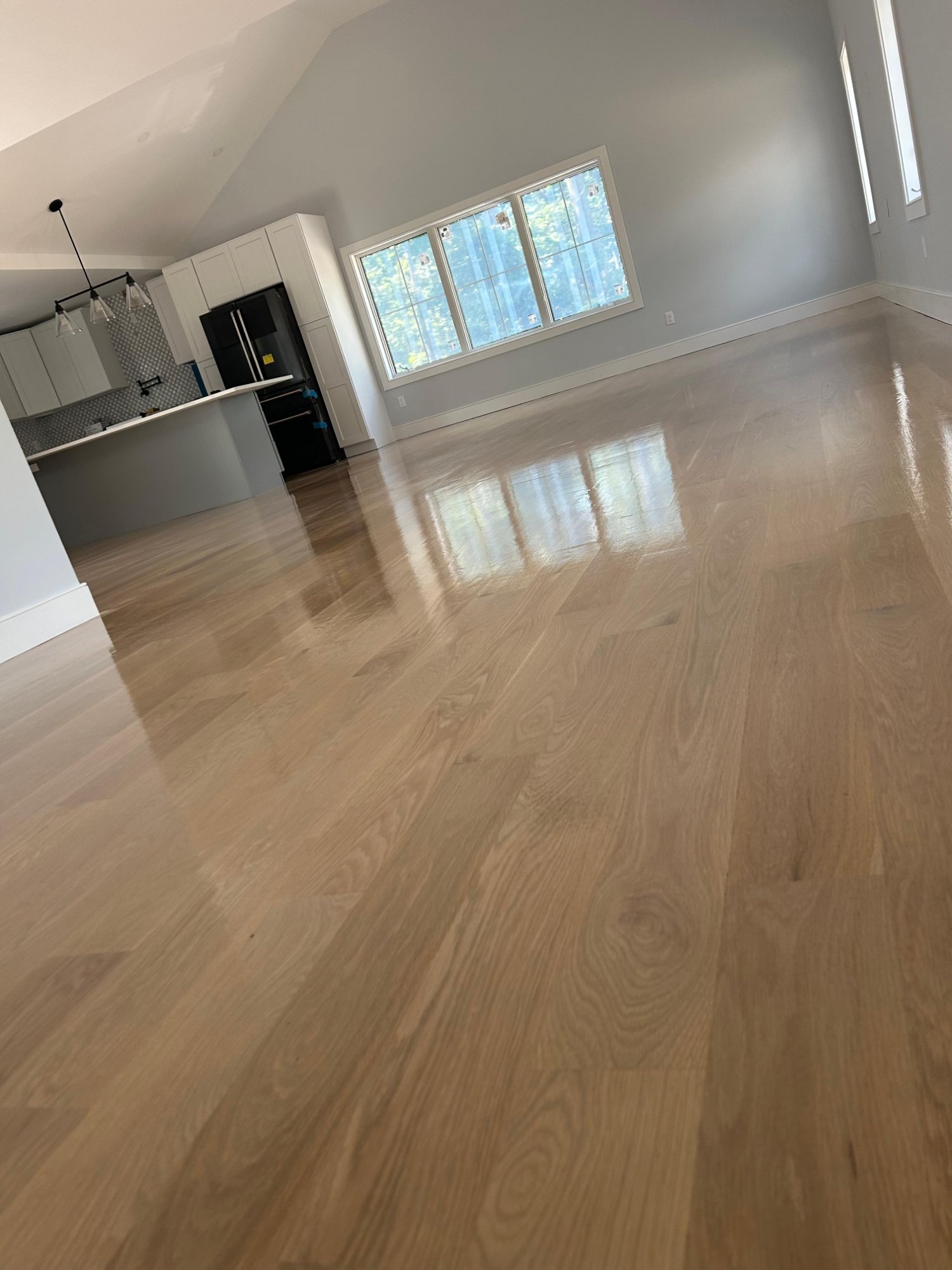 Open concept living room hardwood floor installation